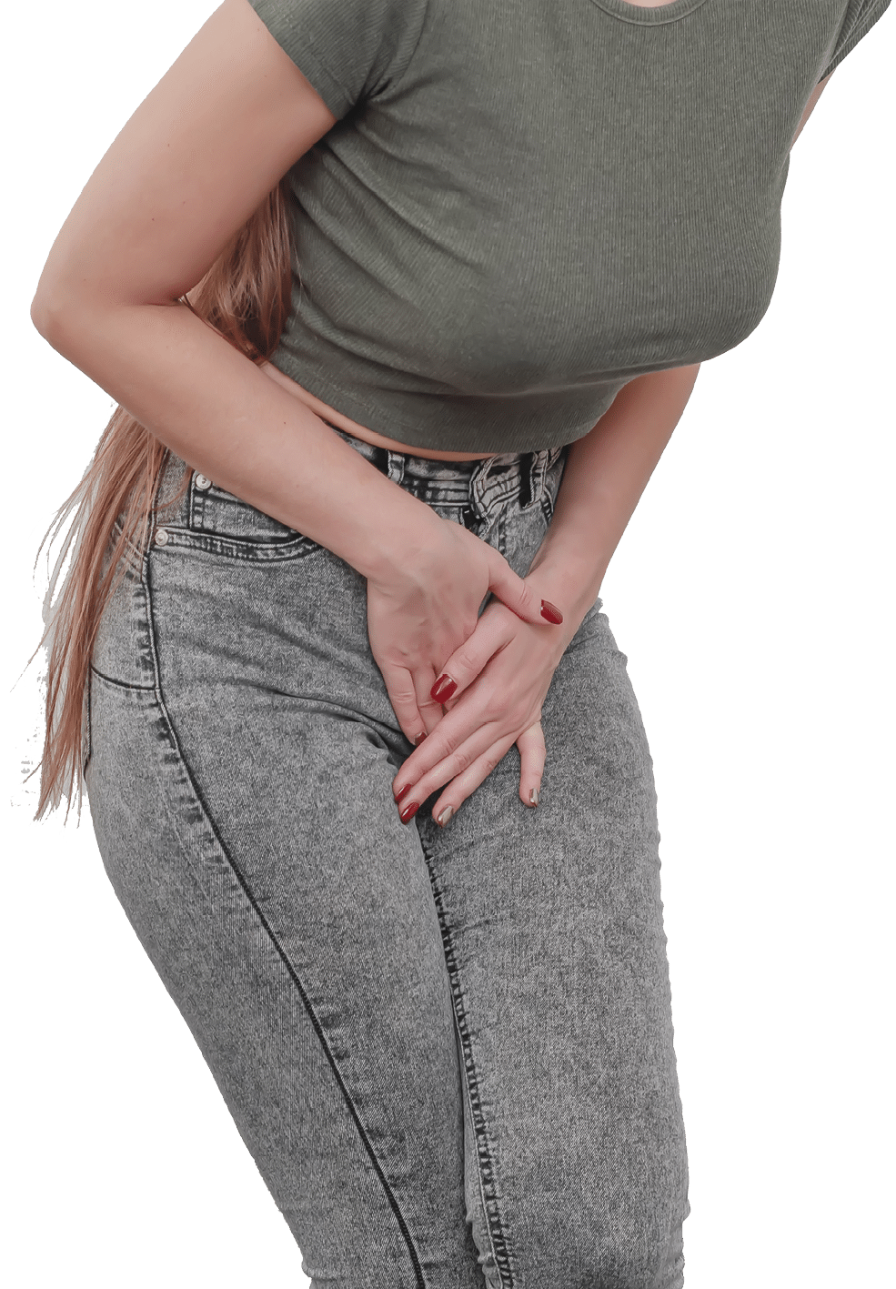 Young slim girl in jeans holds hands pressed between her legs. Women's health, gynecology