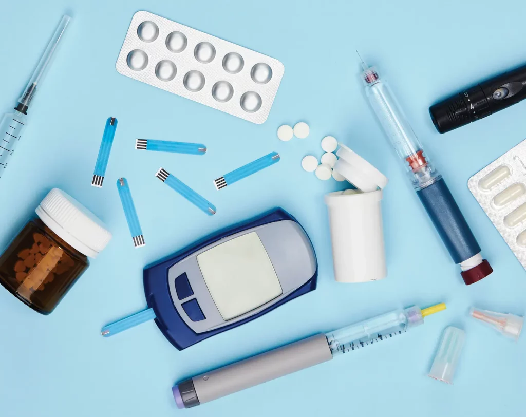 Photograph of various drug options and blood sugar measurement tool in diabetes management