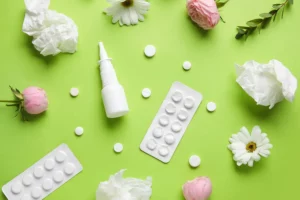 Photograph of different allergy medications and flowers